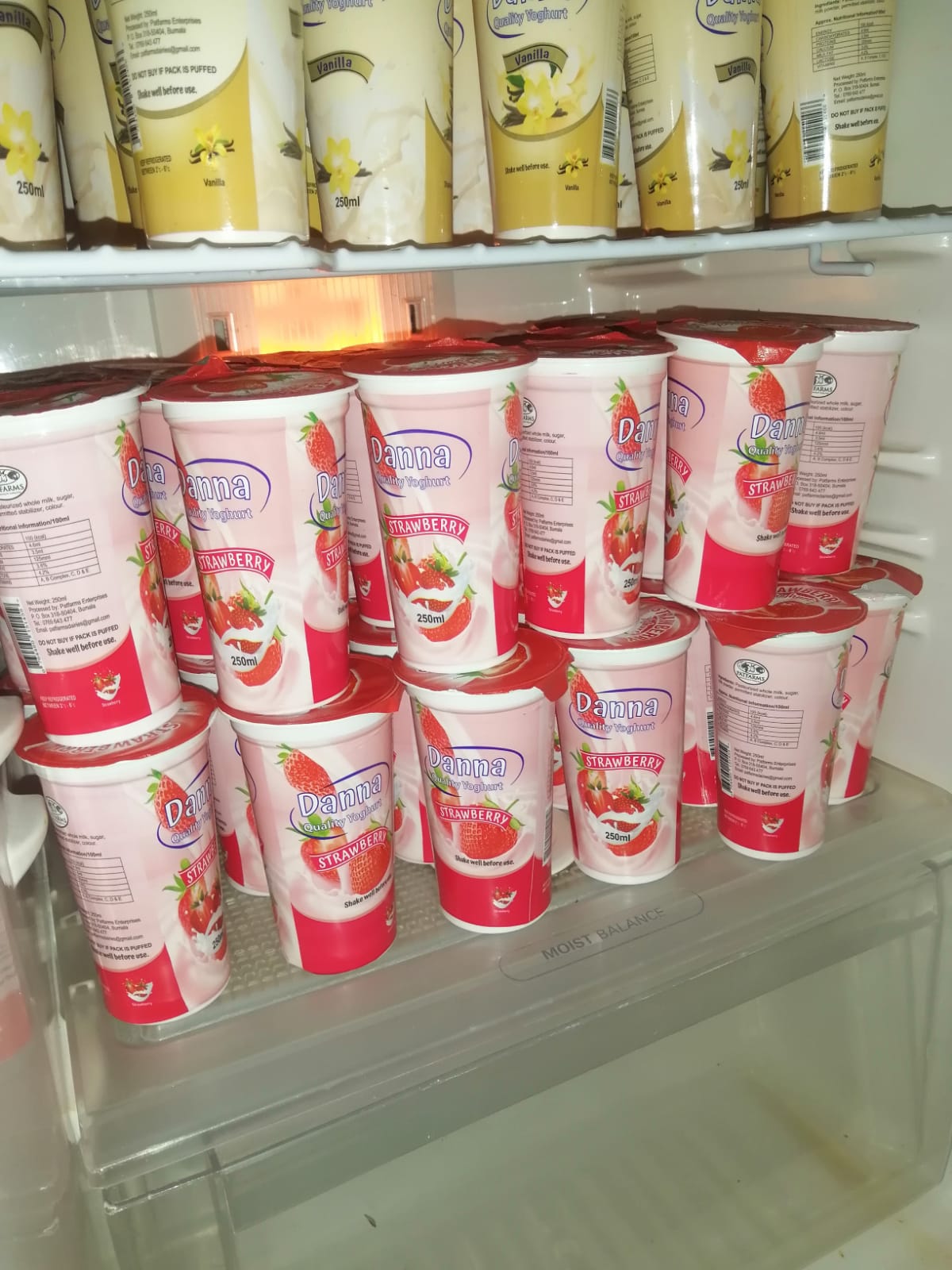 Fridge stocked with Danna strawberry and vanilla yoghurt
